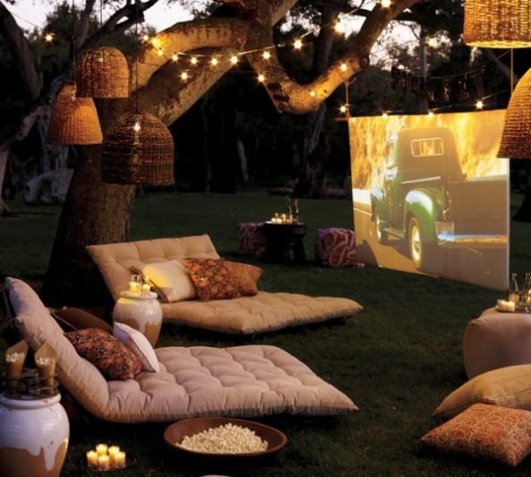 outdoor-cinema-with-soft-furishings-and-tree-lighting-600x540
